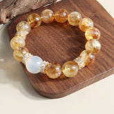 Handmade golden citrine bracelet with 8mm beads, attracting prosperity and abundance.
